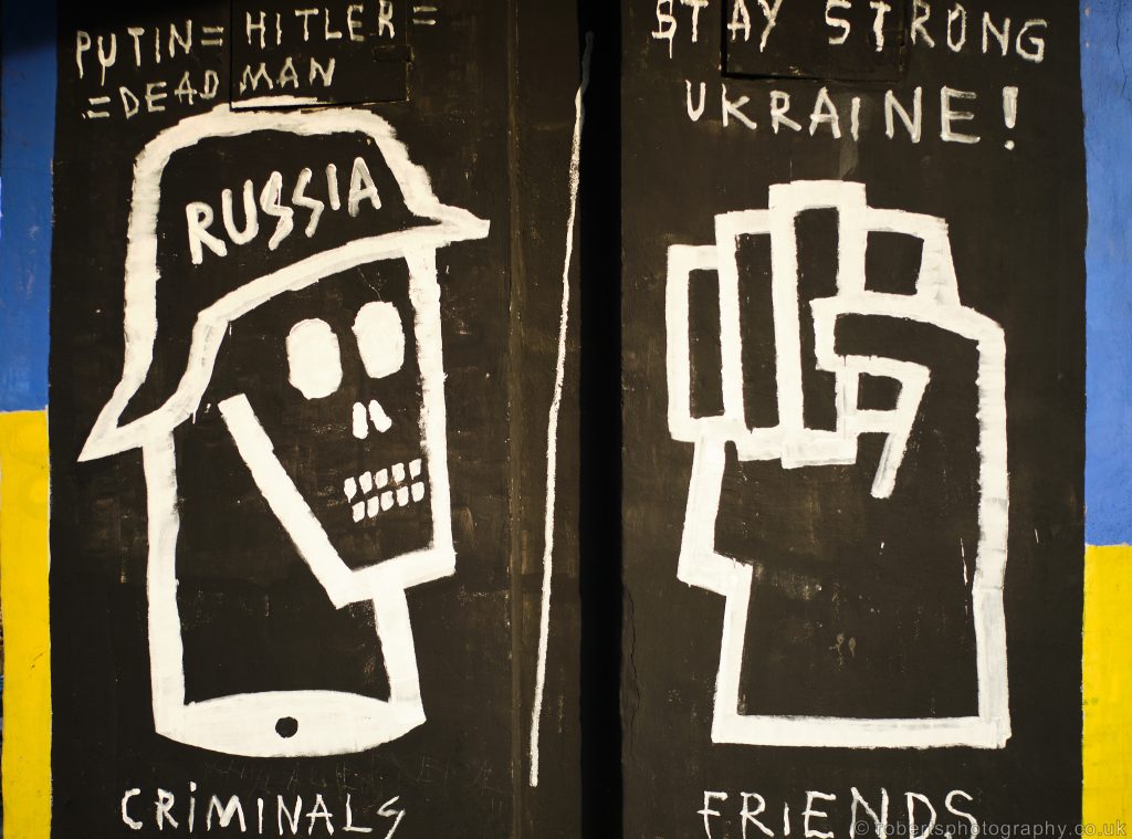 Graffiti under a bridge in Central Gdansk, Poland. Equates Putin to Hitler and Ukraine as friends.