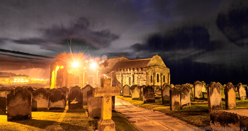 Night view of Whitby Abbey and Gravestones.