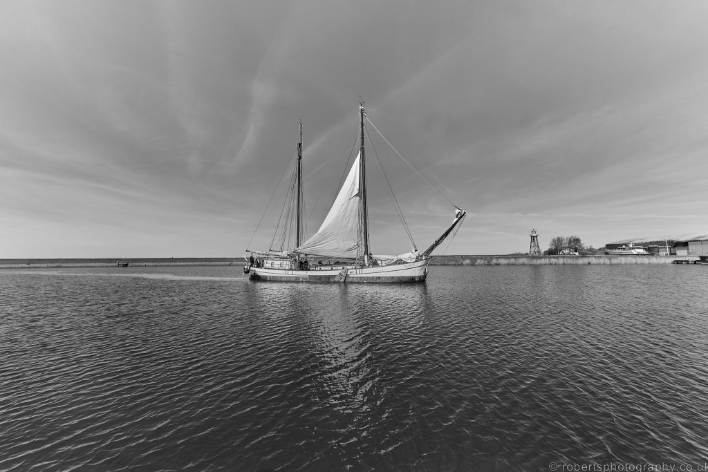 A Lemsteraak, traditional Dutch sailing barge sails into Stavoren, Friesland, North Holland, The Netherlands.